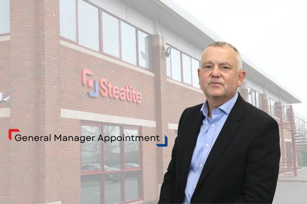 General Manager in front of Steatite building